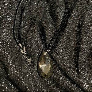 Beautiful 🤩 long necklace with an exquisite smokey-black pendant.